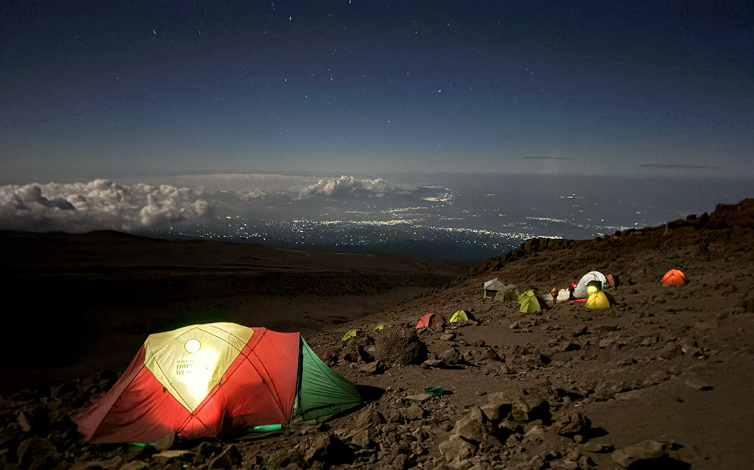 A tent at night on the mountainside of Mt. Kilimanjaro