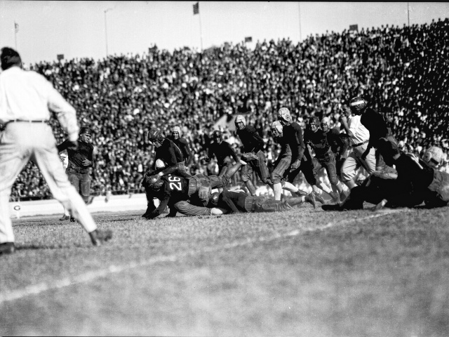 A photo from a 1926, Texas plays A&M and an Aggie makes a tackle