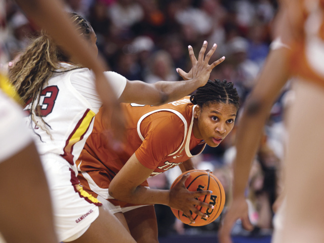 UT Basketball Player Madison Booker searches for a shot.