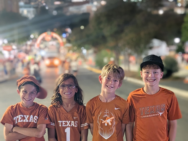 Four young Longhorns fans attend their first UT football game.