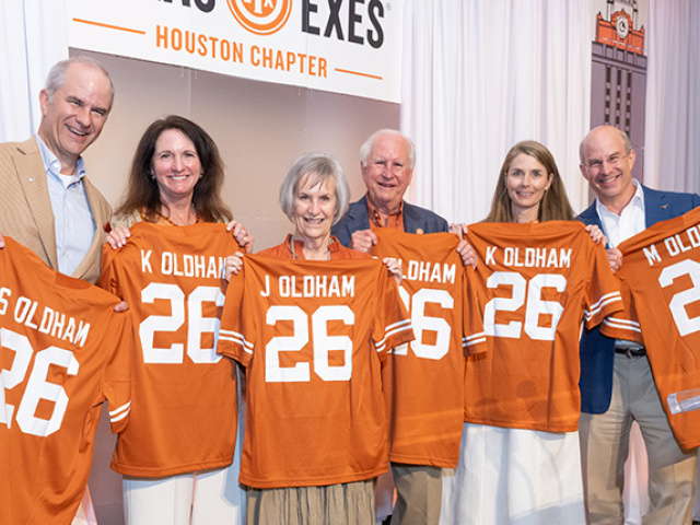 Members of the Oldham family holds UT jerseys.