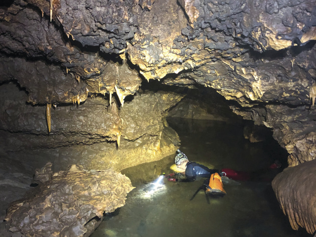 A spelunker in an underground cave.
