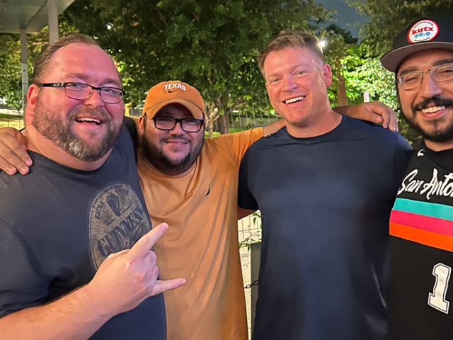 Group of four UT Longhorn alumni.