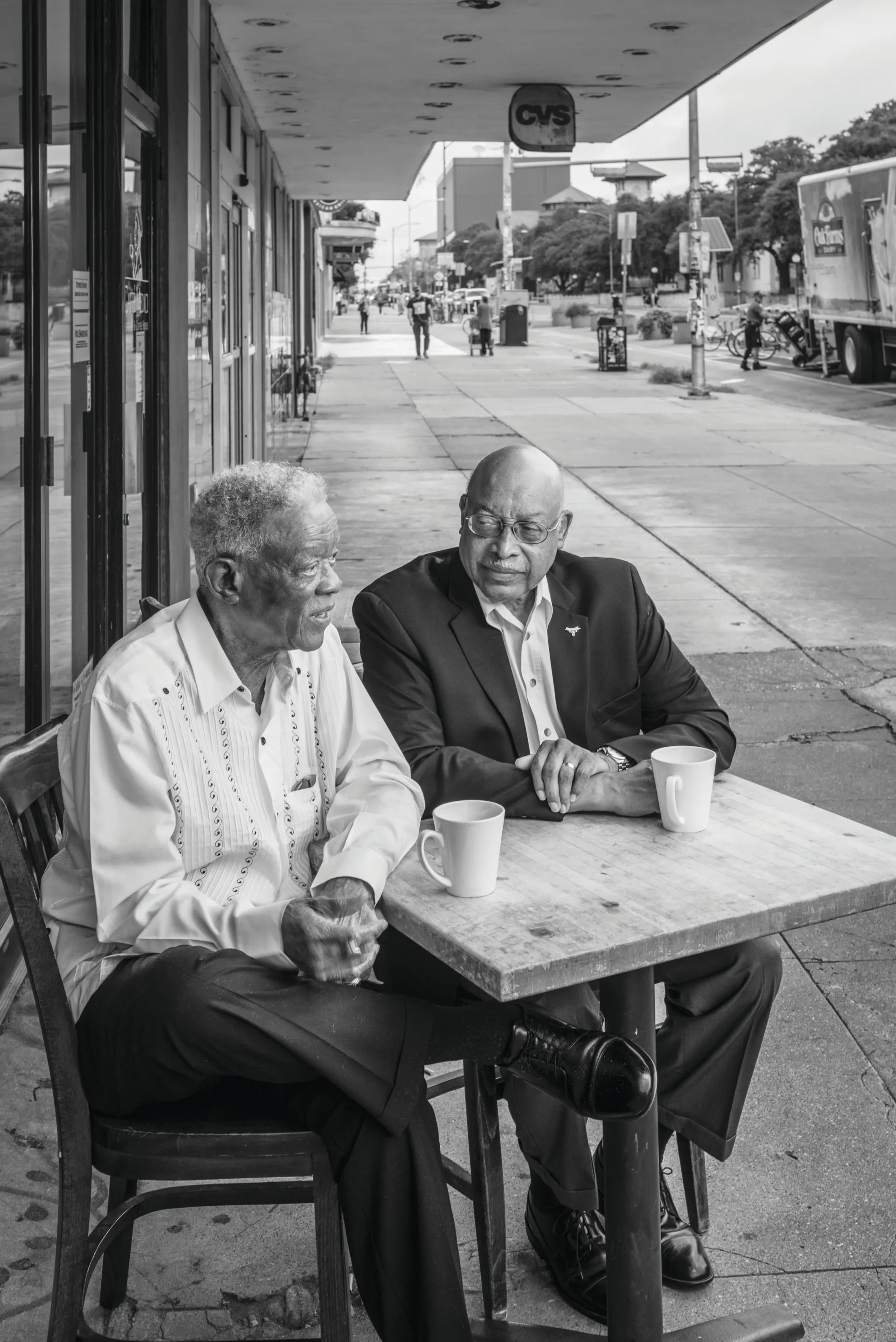 Charles Miles and Leon Holland at a coffee shop on the Drag.