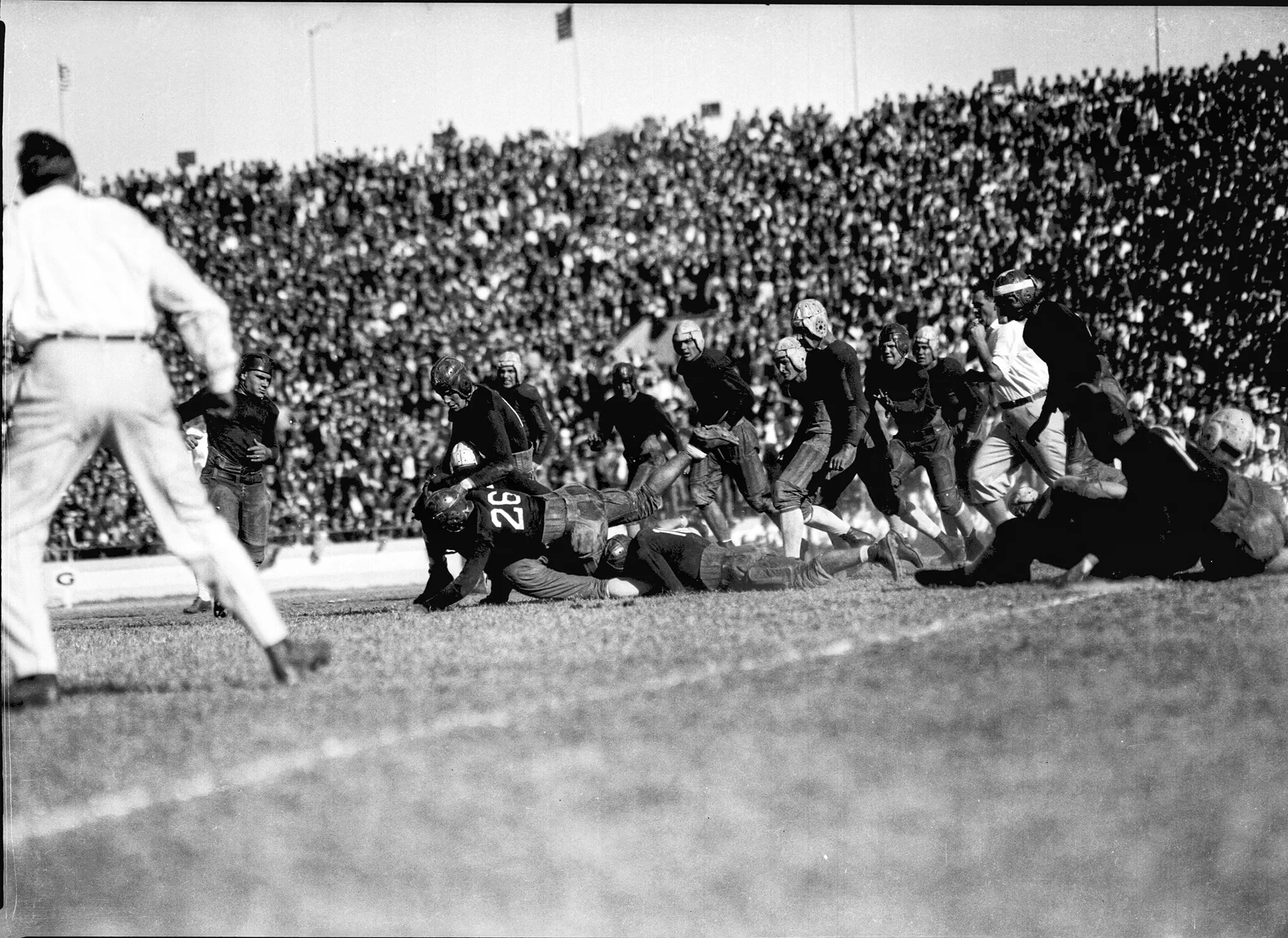 A photo from a 1926, Texas plays A&M and an Aggie makes a tackle