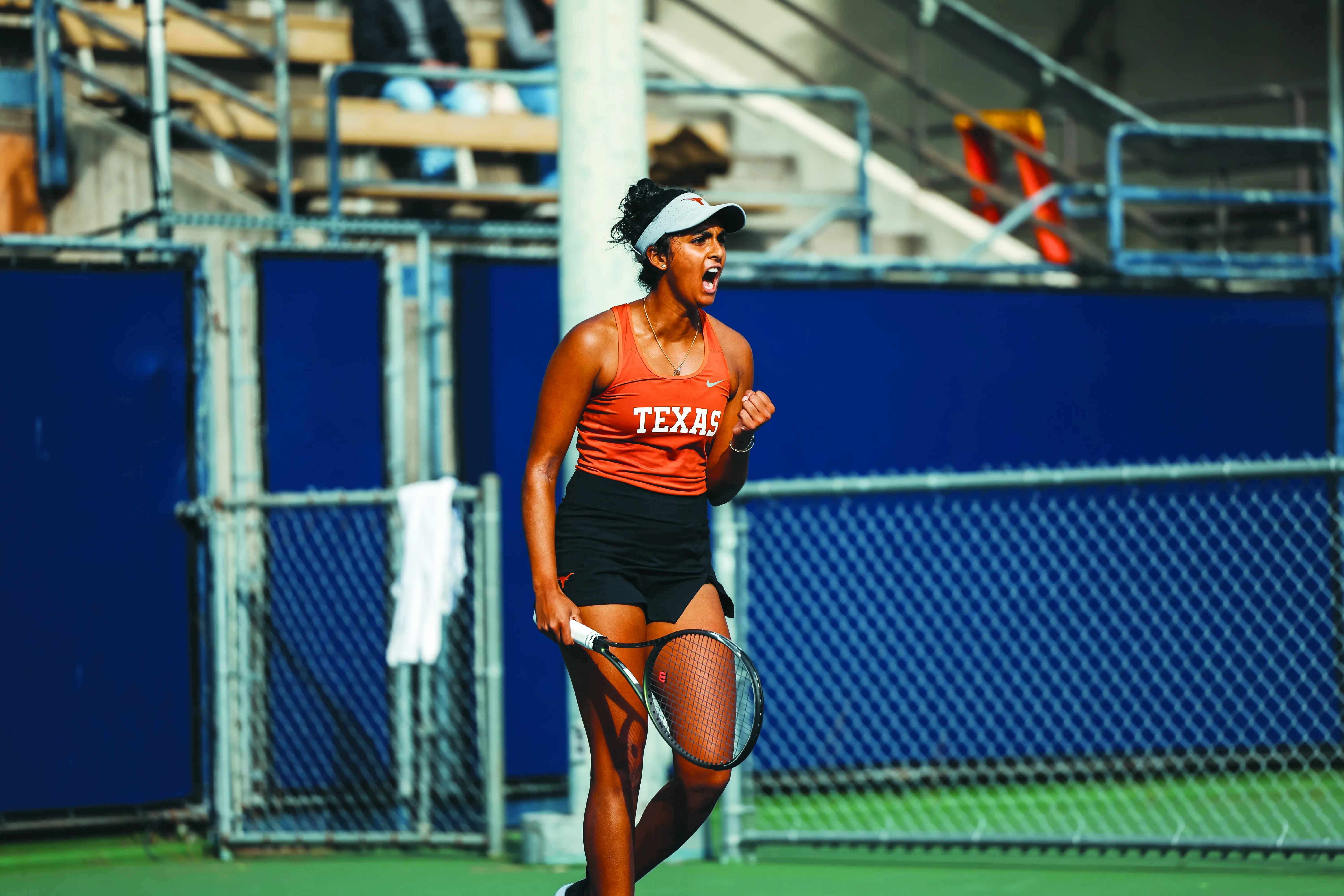 Malaika Rapolou celebrates on tennis court.