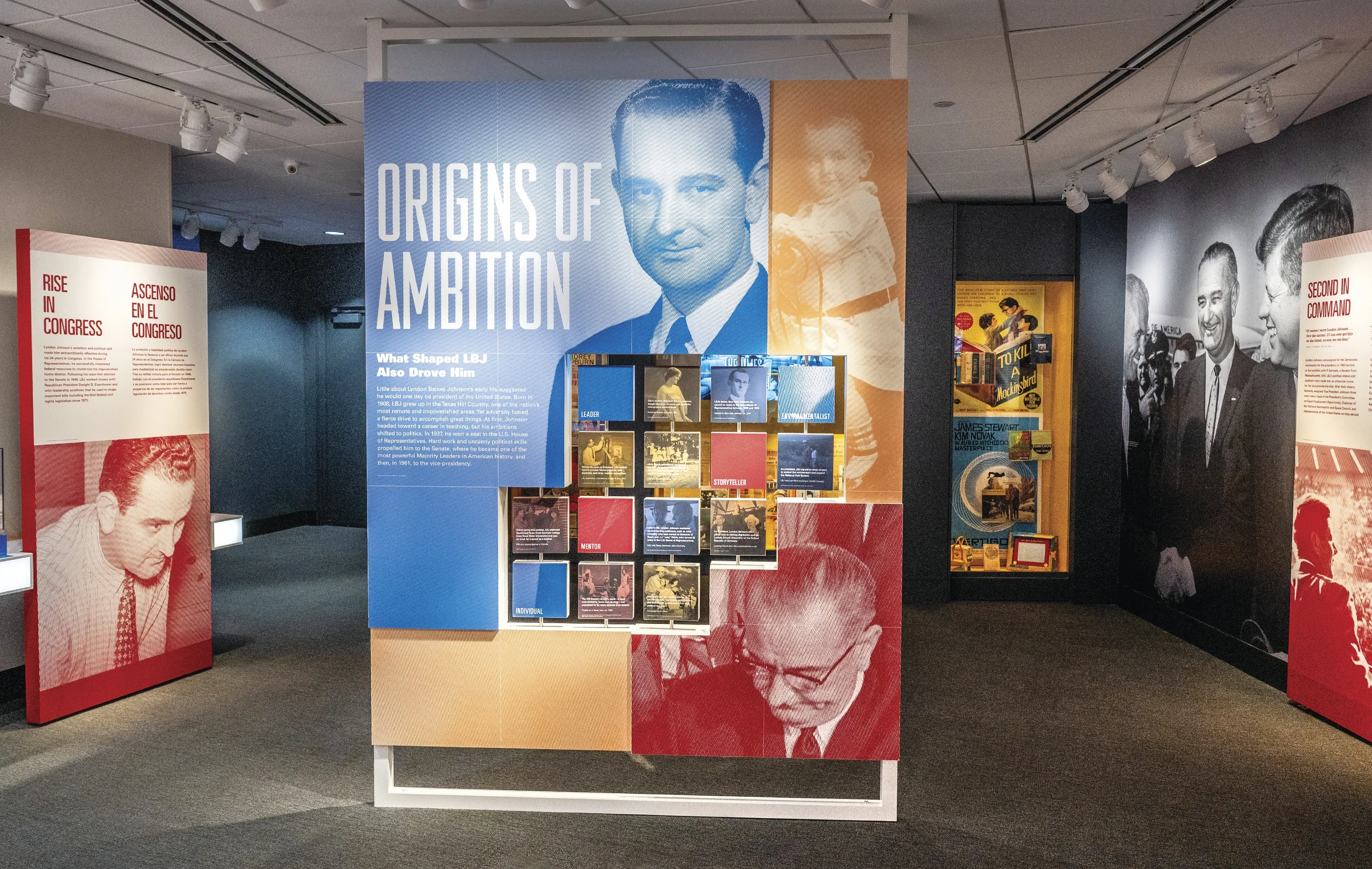 A wall at an LBJ Library exhibit reads "Origins of Ambition" with a photo of a young LBJ.