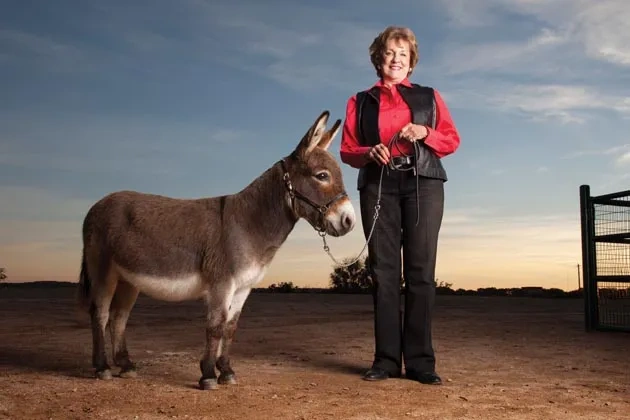 Rhetta McAllister with miniature donkey