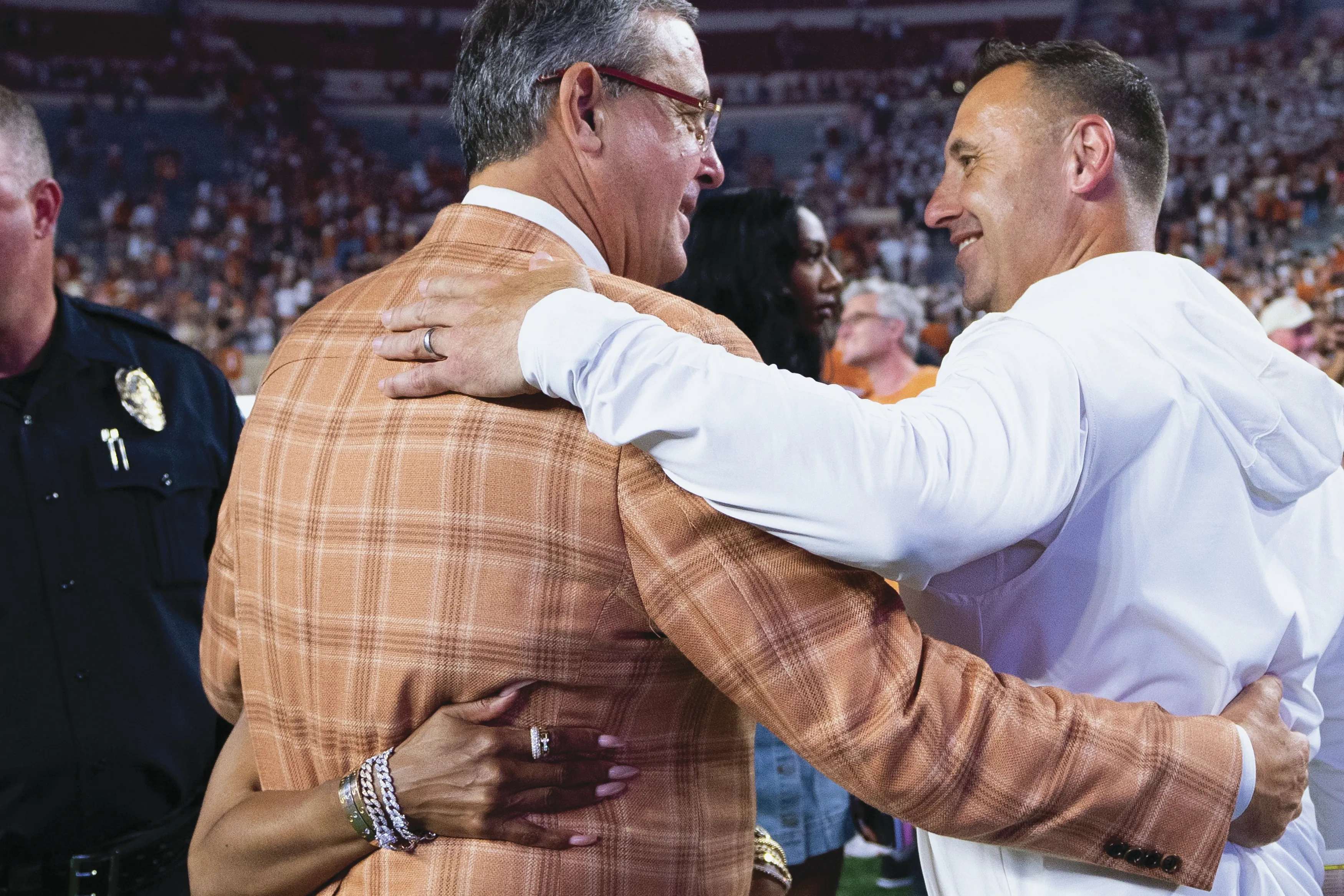Chris Del Conte and Steve Sarkisian on the Sideline