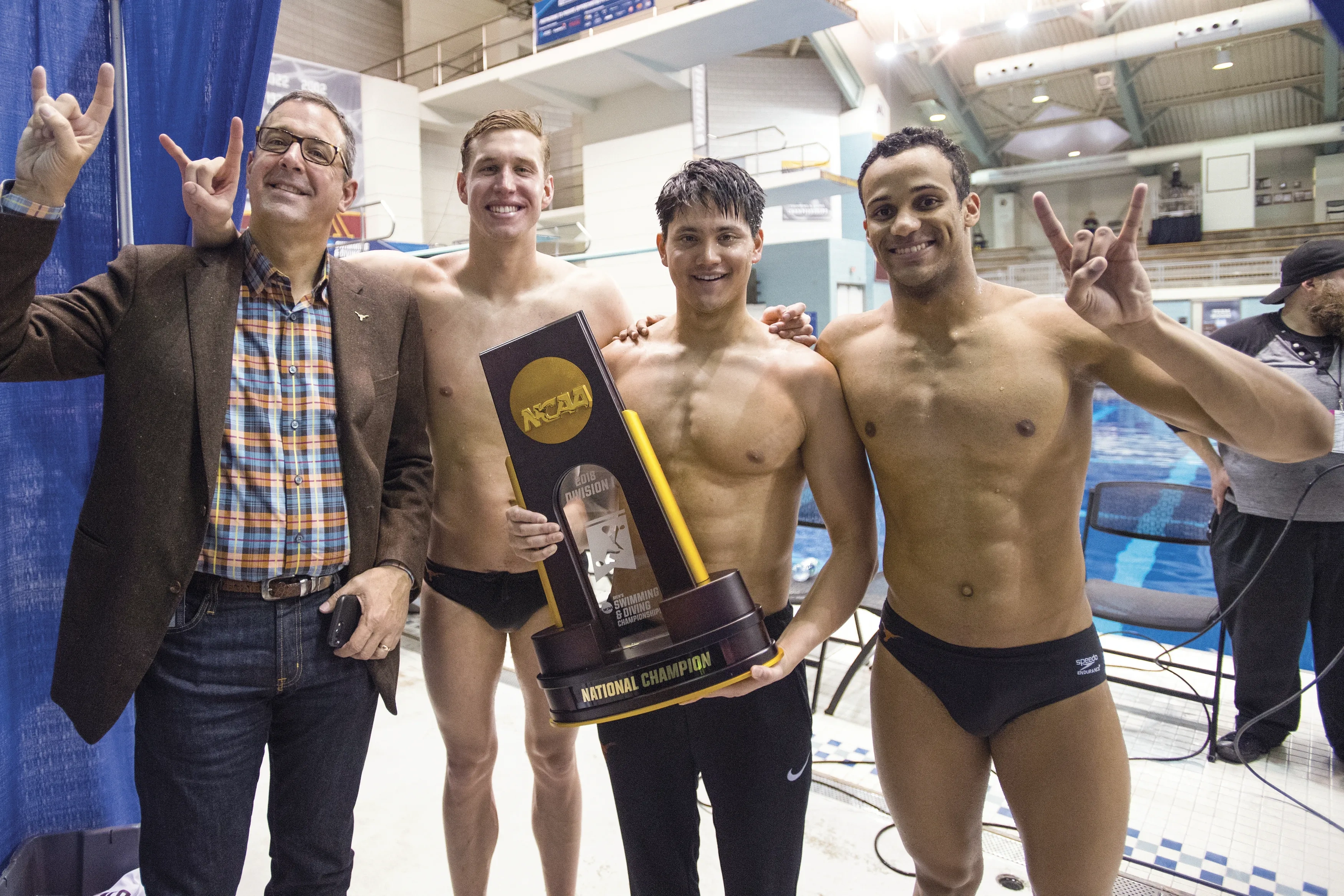Chris Del Conte with Texas swimmers