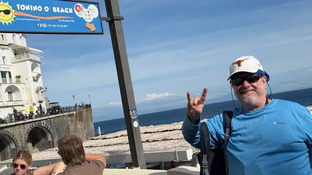 A man stands at Tonino Beach at the Amalfi Coast in Italy. 