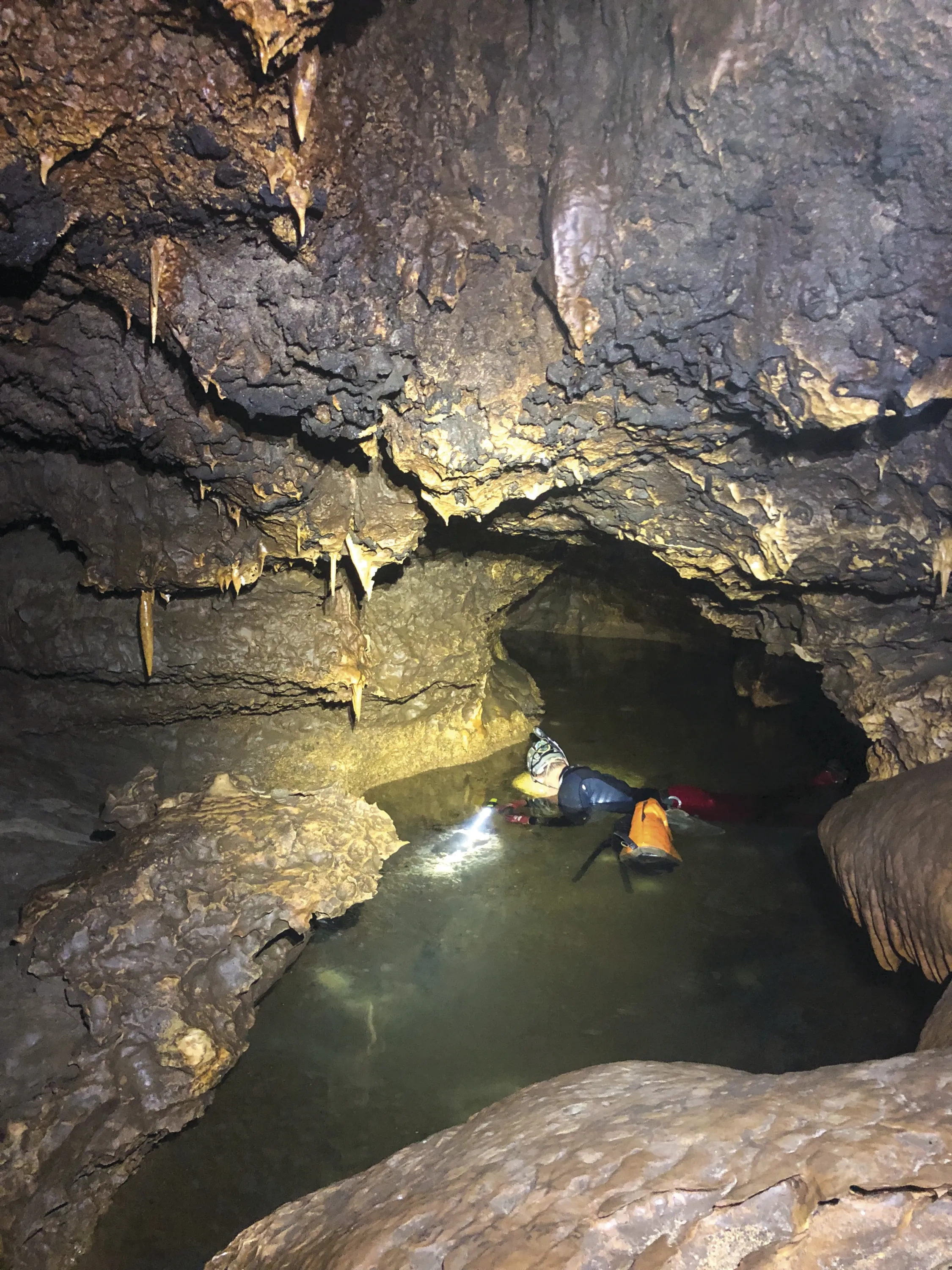 A spelunker in an underground cave.