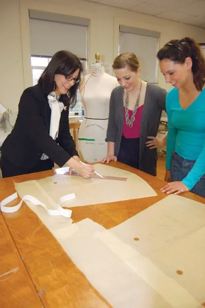 Lecturer Karen Bravo working with students.