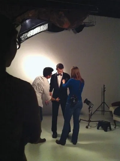 Christopher Lam prepares a model for a Brenda Ladd photo shoot. Suit by Colton Gerard.