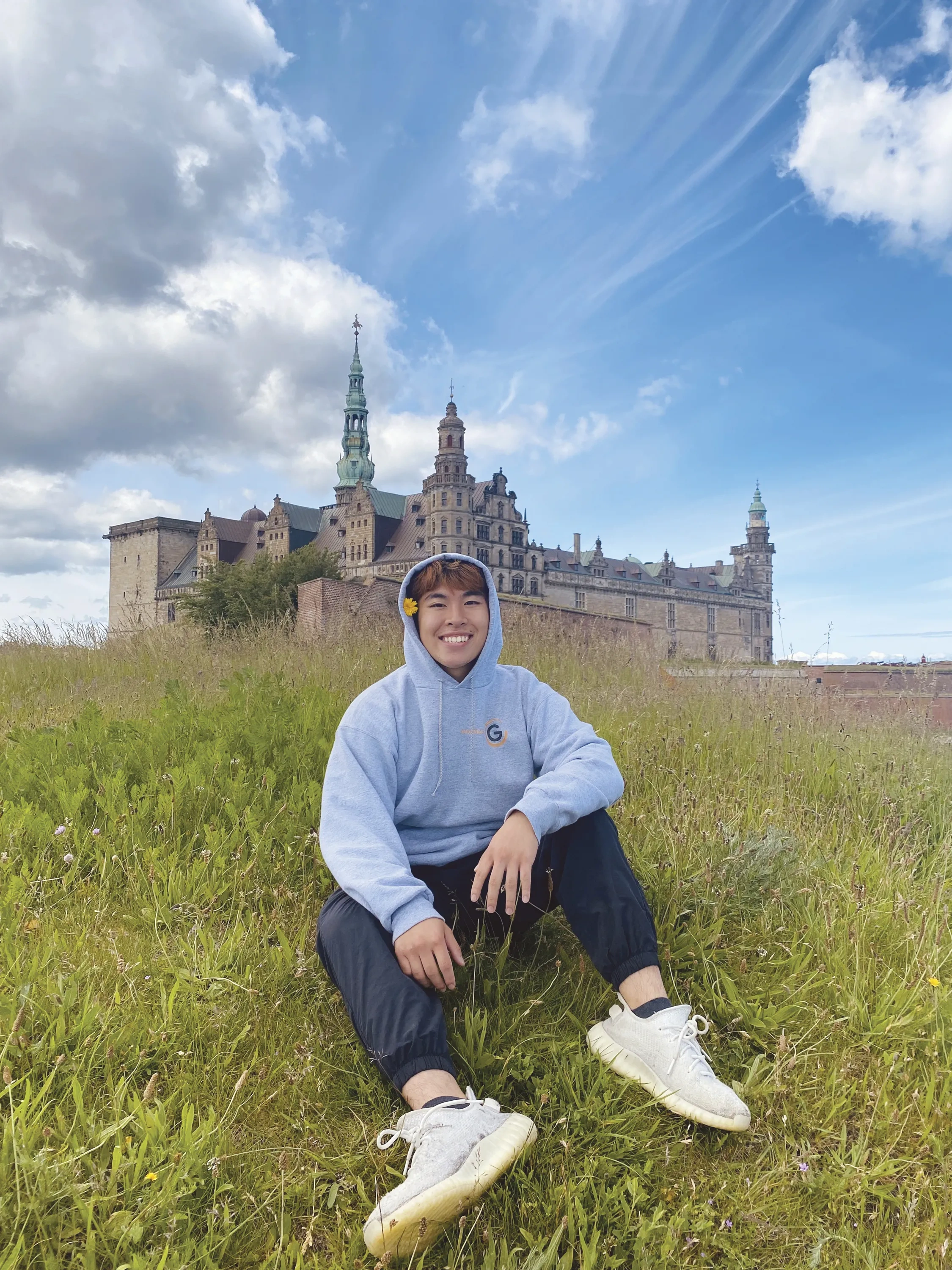 Student in front of a castle in Denmark. 