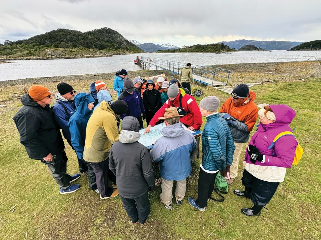 People huddle around a map.