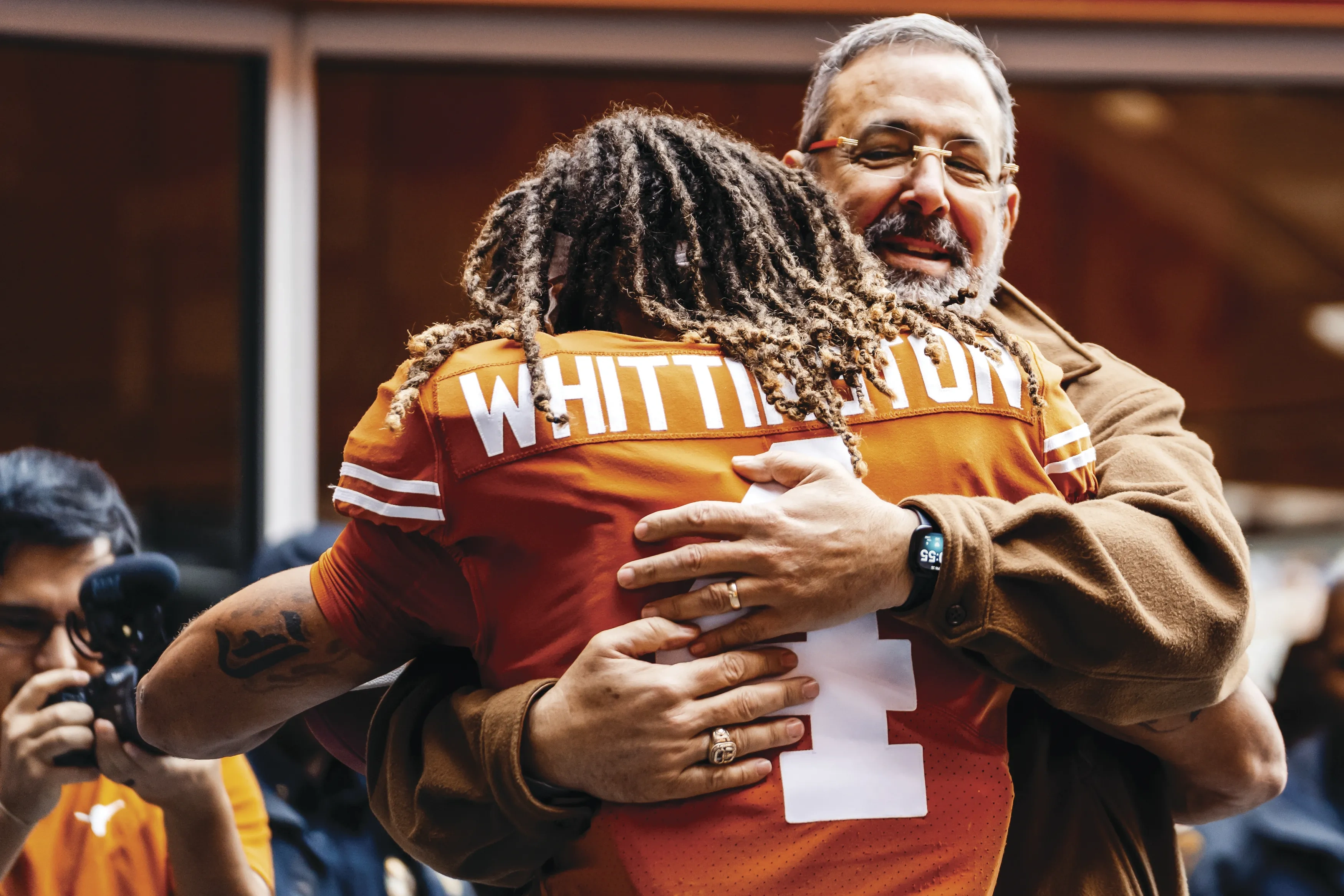 Chris Del Conte hugging Jordan Whittington