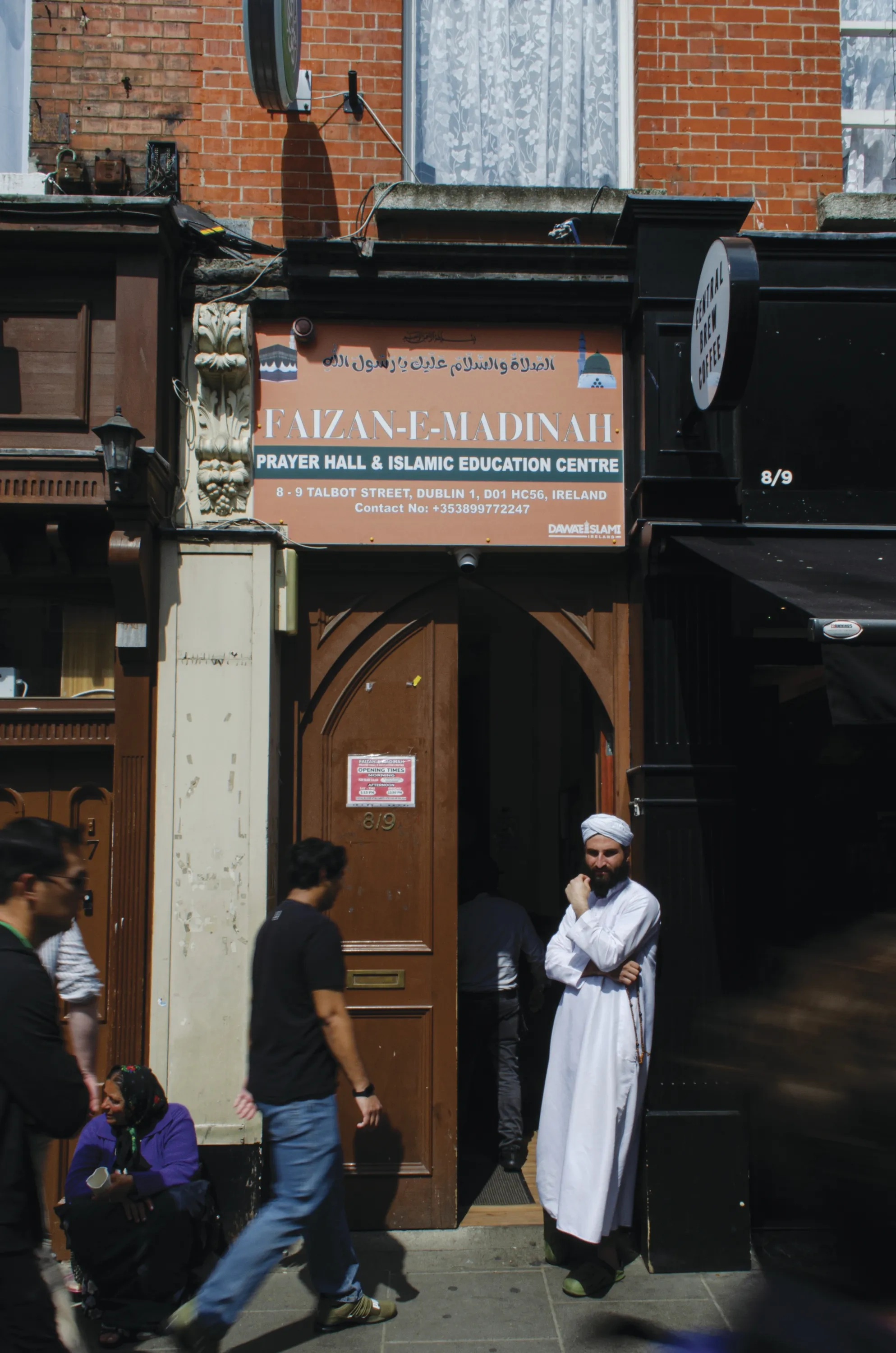 People walking into a prayer hall in Dublin