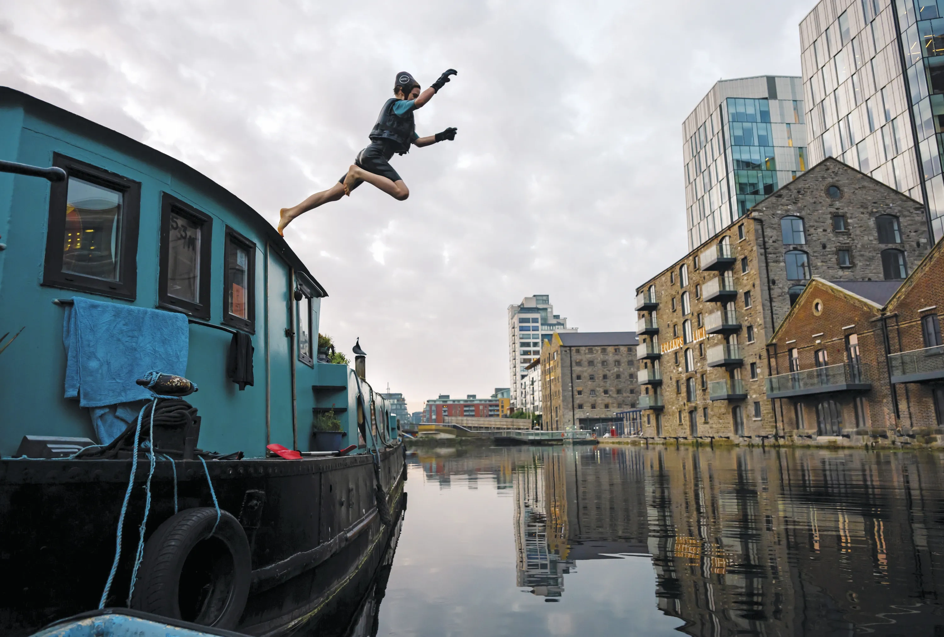 A person leaps from a boat in Ireland