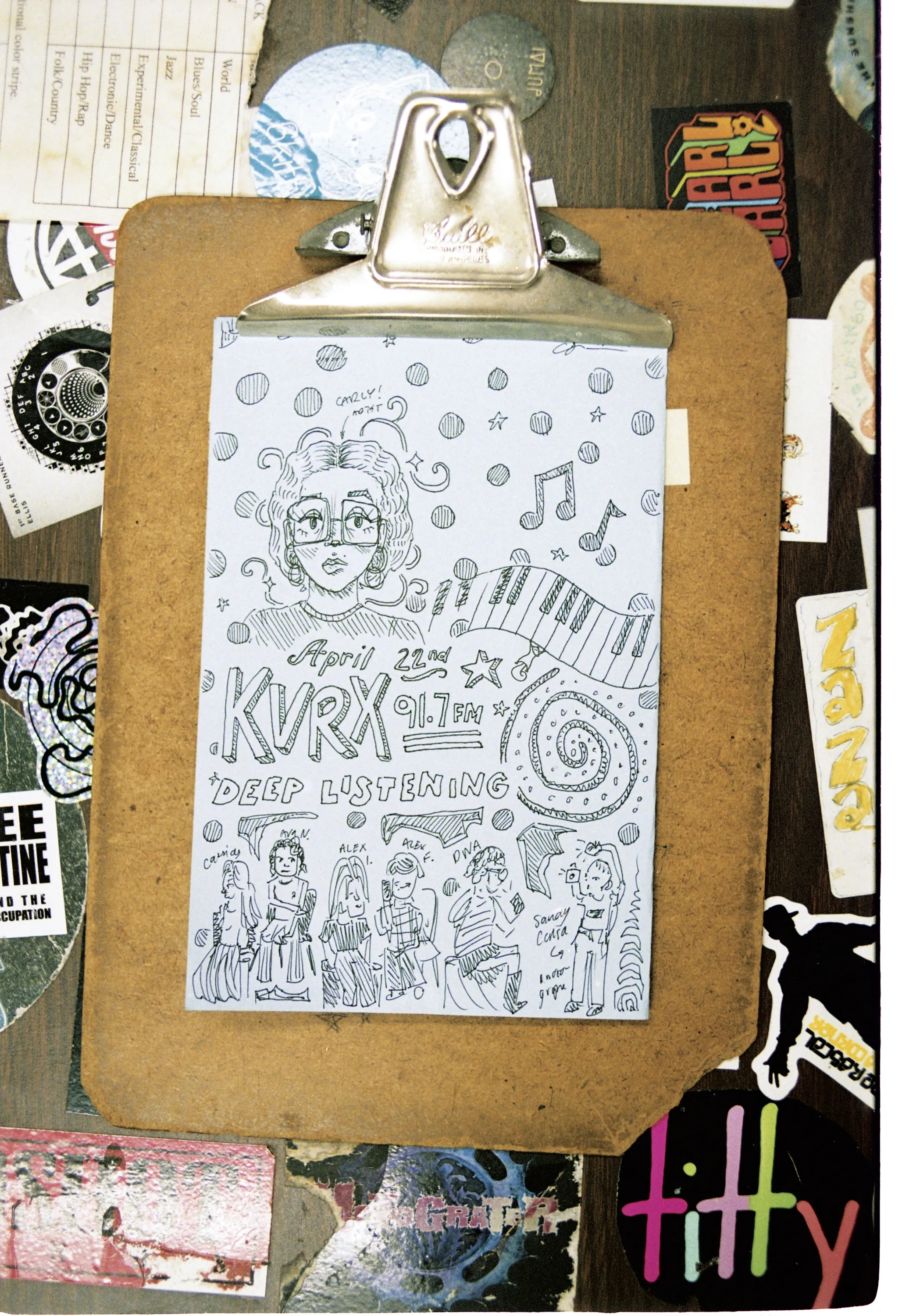 A clipboard holding a doodled pencil drawing.